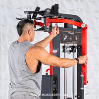 Thumbnail for Man adjusting the settings on a red and black pec/rear delt combo machine.