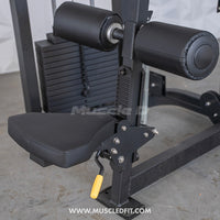 Thumbnail for Close-up of a black seated lat pull machine with weight stack, seat, and leg pads.