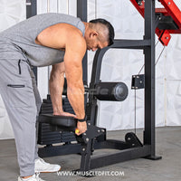 Thumbnail for Man adjusting the thigh pad on a black selectorized seated lat pull machine.