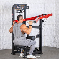 Thumbnail for Man in gray tank top using a black and red seated lat pull machine.