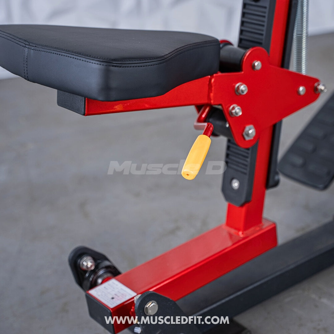 Close-up of a red and black seated row machine with a black seat and yellow adjustment handle.