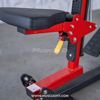 Thumbnail for Close-up of a red and black seated row machine with a black seat and yellow adjustment handle.