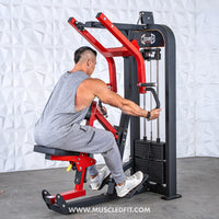 Thumbnail for Man in gray tank top using a red and black seated row machine with multi-grip handles.