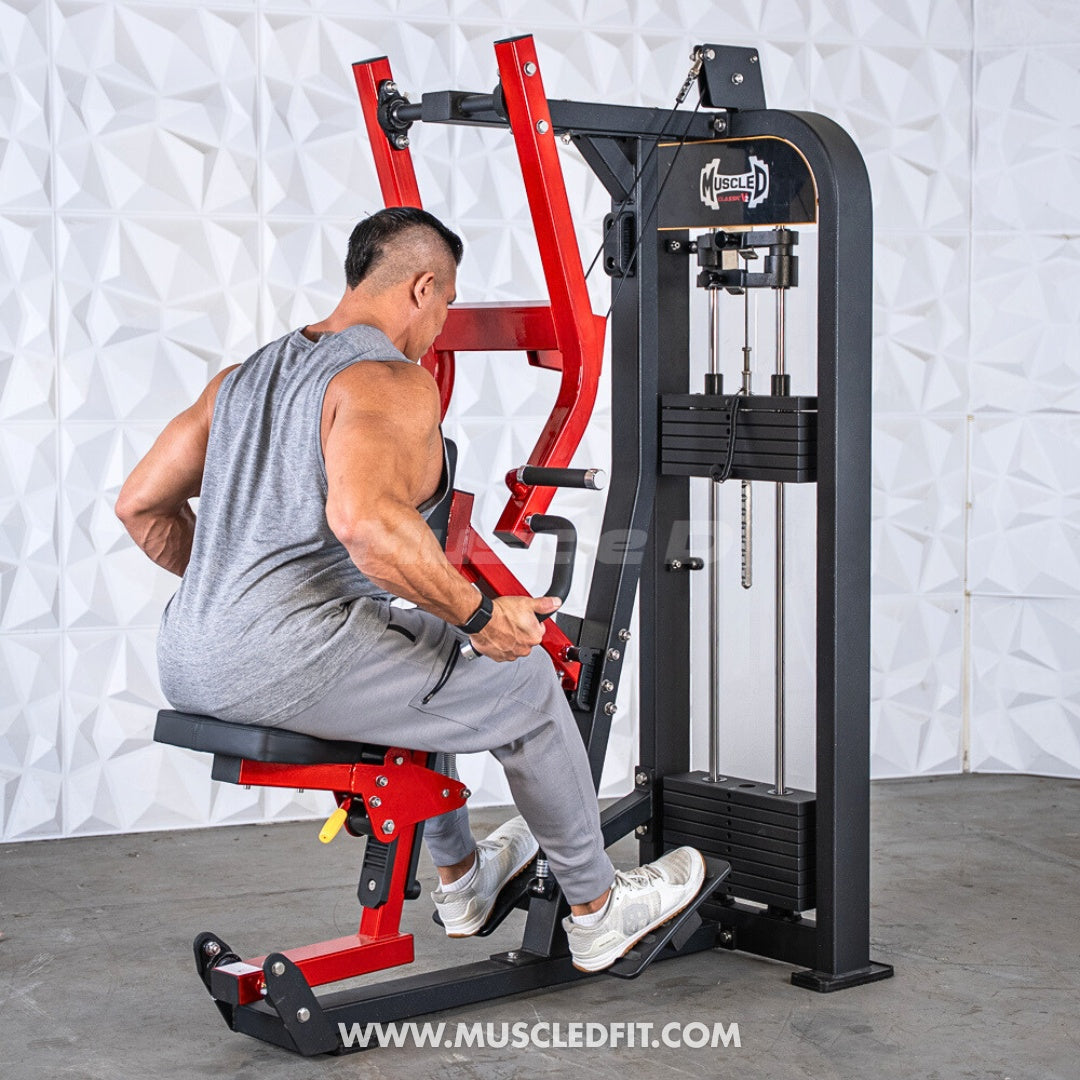 Man using a red and black selectorized seated row machine with multi-grip handles and weight stack.