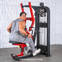 Thumbnail for Man using a red and black selectorized seated row machine with multi-grip handles and weight stack.