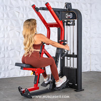 Thumbnail for Woman using a red and black selectorized seated row machine with multi-grip handles and a weight stack.