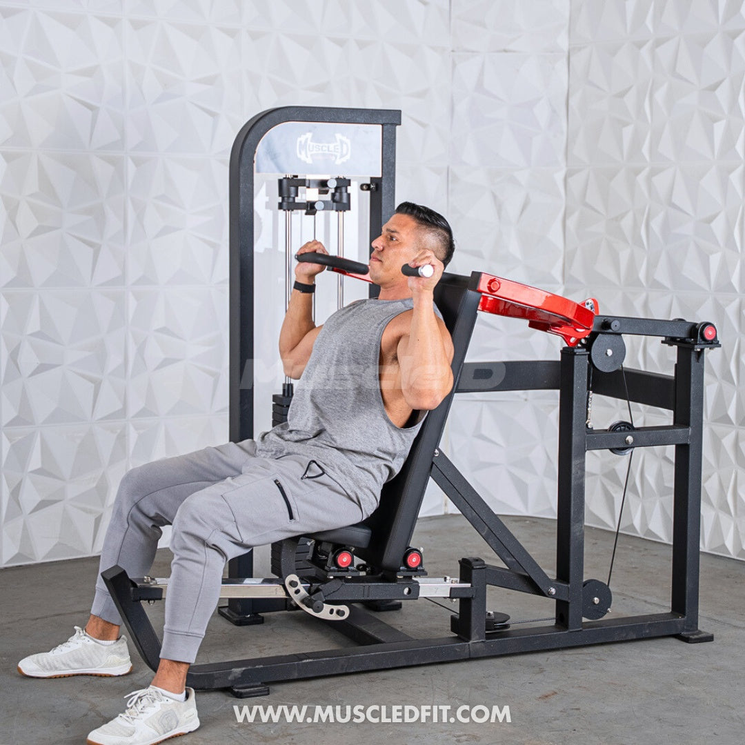 Man using a black and red selectorized multi-press chest and shoulder machine.