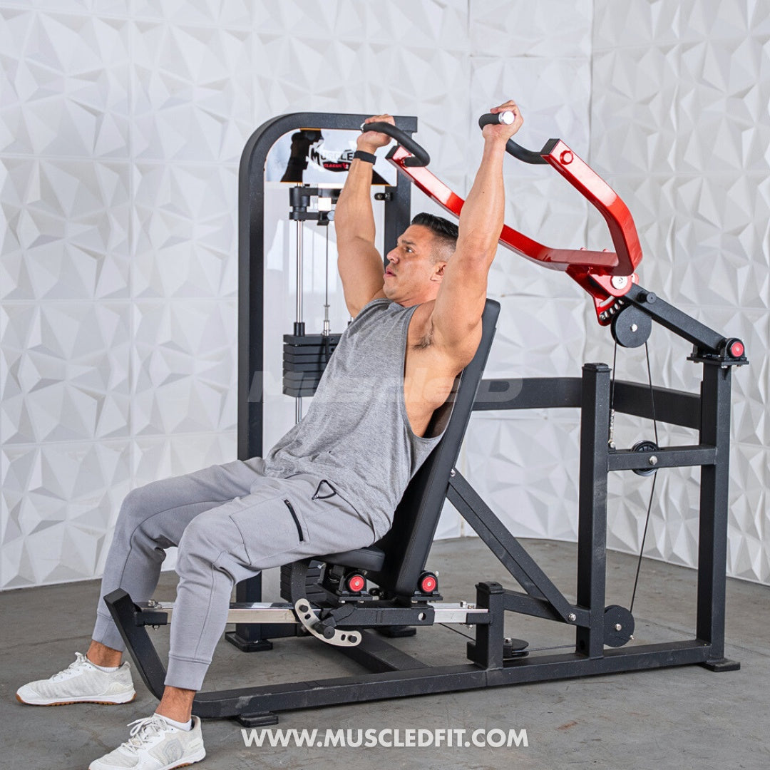 Man using a black and red selectorized multi-press chest and shoulder machine.