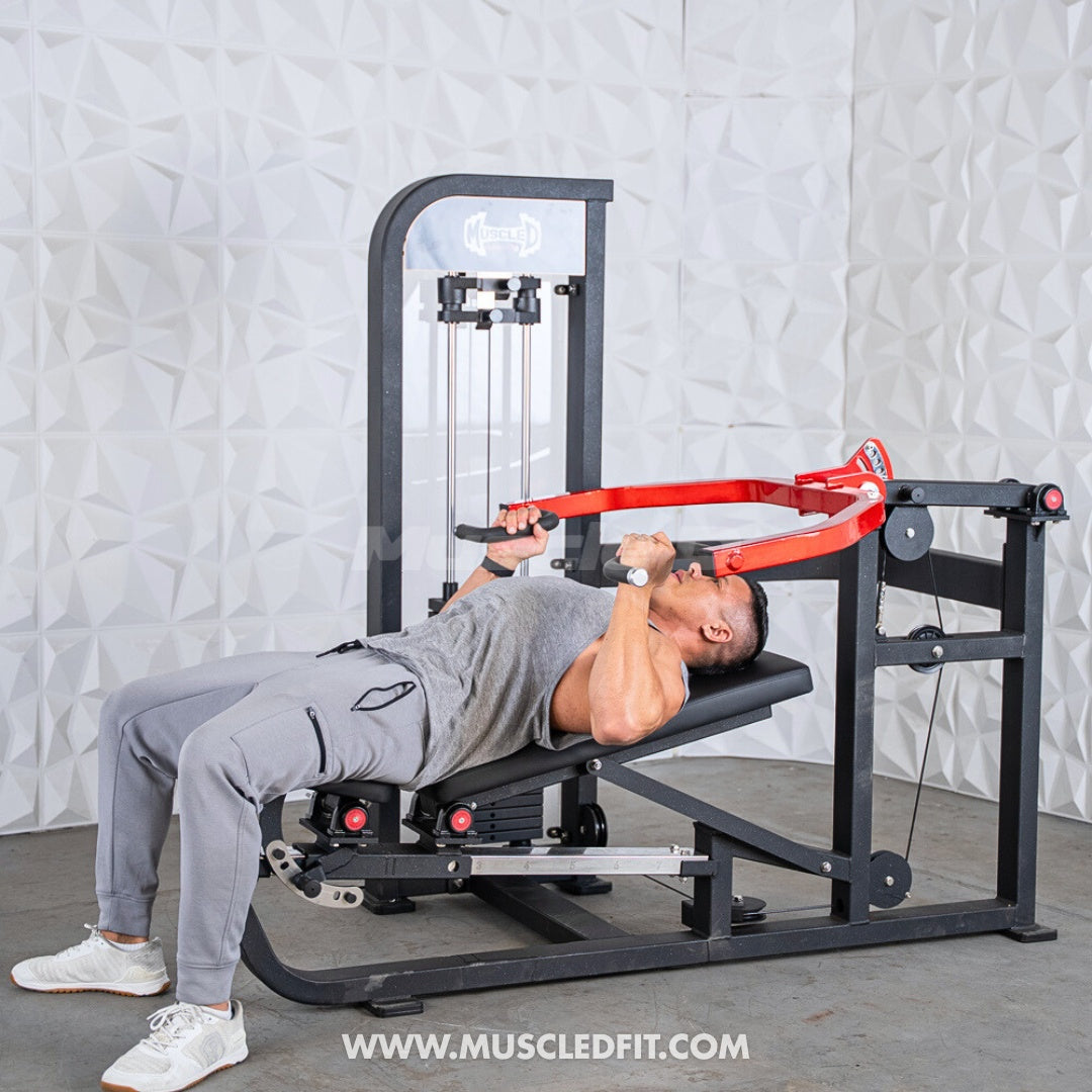 Man using a black and red selectorized multi-press chest and shoulder machine.