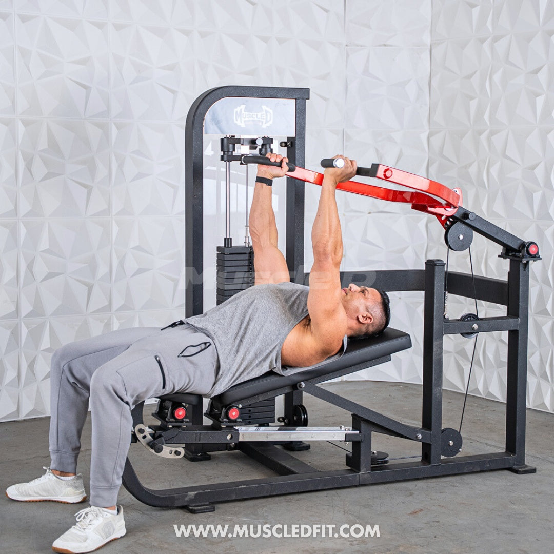 Man performing a chest press on a black and red selectorized multi-press machine.