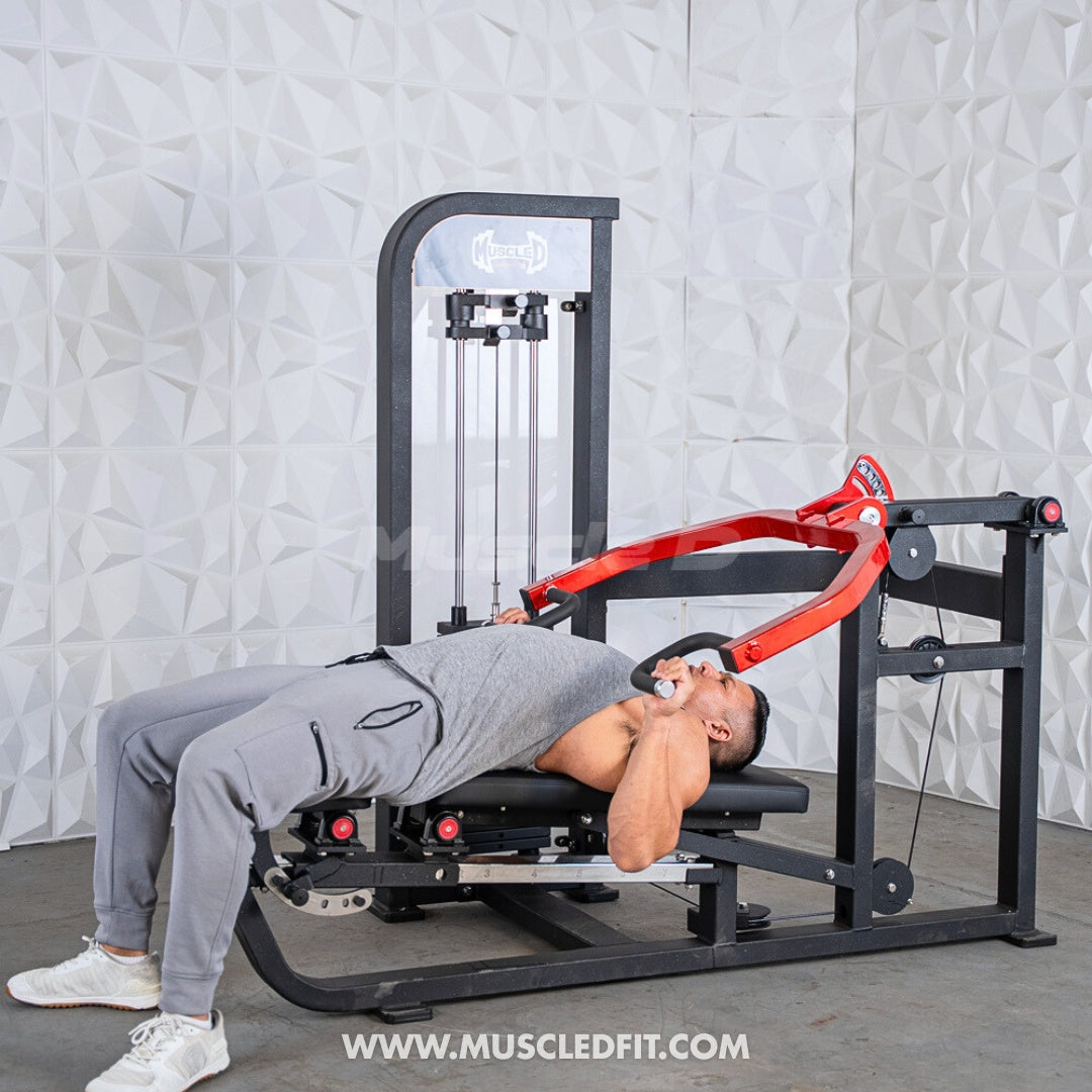 Man using a black and red selectorized multi-press chest and shoulder machine.