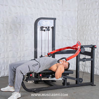 Thumbnail for Man using a black and red selectorized multi-press chest and shoulder machine.