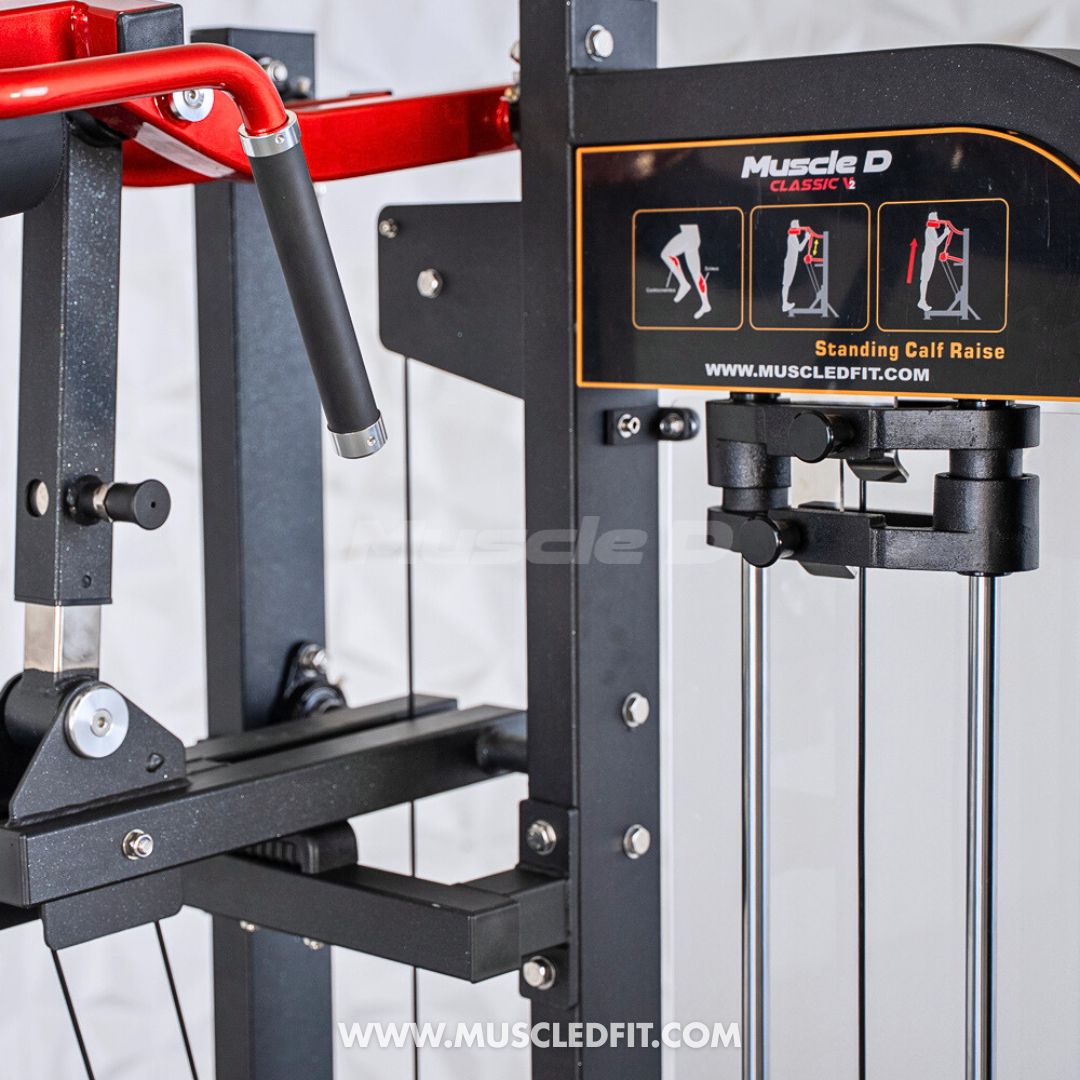 Close-up of a black and red standing calf raise machine with exercise instructions on an orange label.