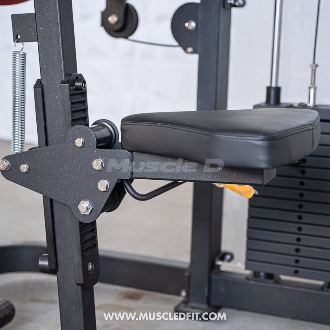 Close-up of a black padded seat and adjustable leg rest on a commercial gym machine.