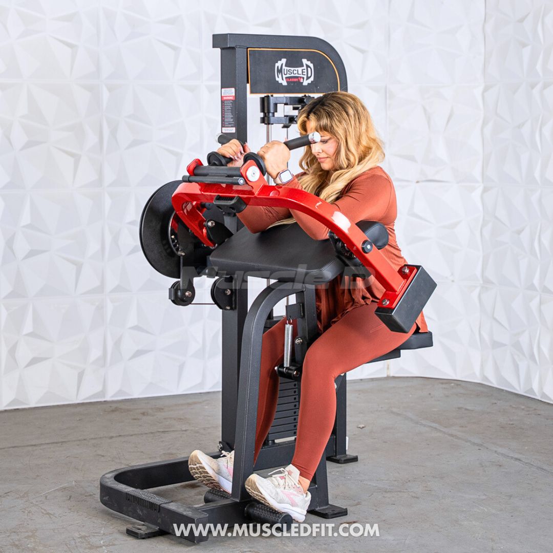 Woman using a red and black biceps/triceps combo machine with weight stack.