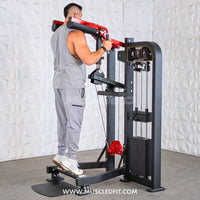 Thumbnail for Man using a black and red selectorized standing calf raise machine with weight stack.