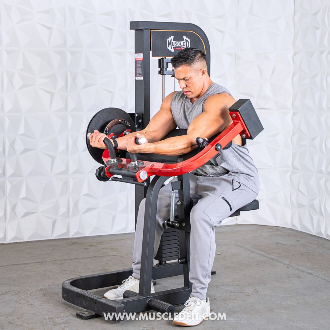 Man using a black and red biceps/triceps combo machine, performing a biceps curl.
