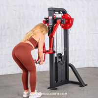 Thumbnail for Woman using a black and red lateral raise machine with a weight stack.