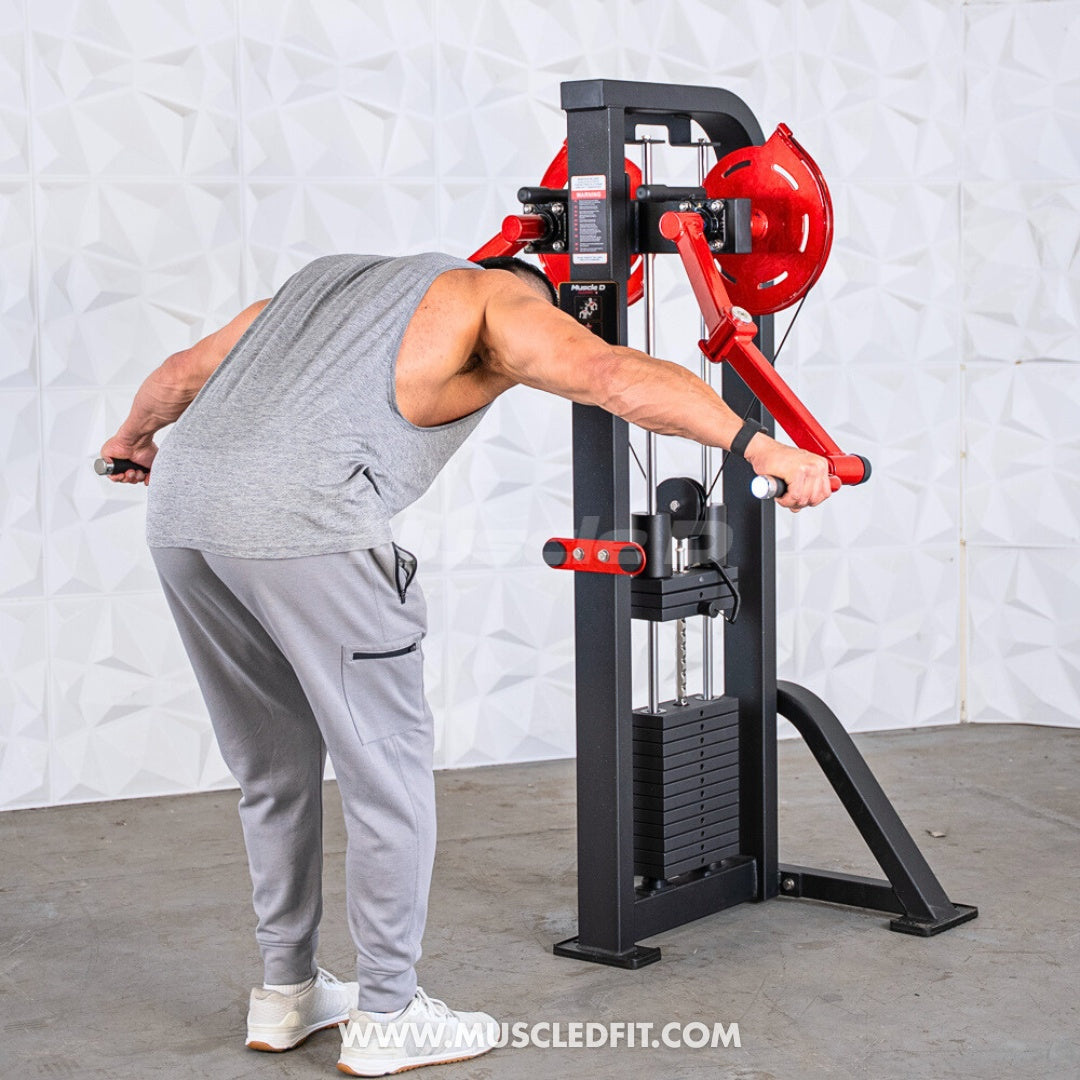 Man using a black and red lateral raise machine with weight stack.