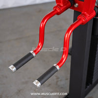 Thumbnail for Close-up of the red handles with black grips on the lateral raise machine.