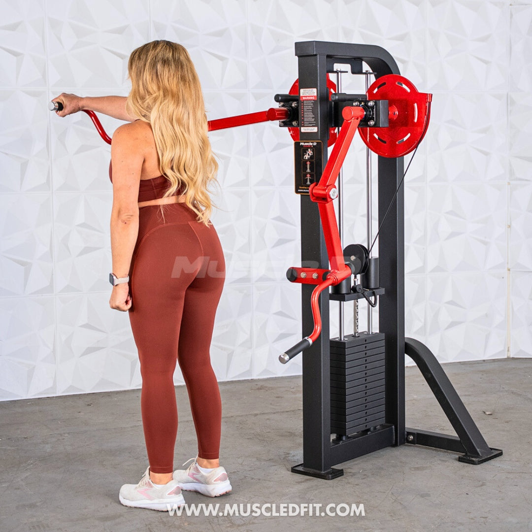 Woman using a black and red selectorized lateral raise machine with a weight stack.