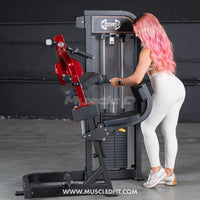 Thumbnail for Woman with pink hair using a red and black selectorized triceps extension machine.