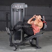 Thumbnail for Man doing crunches on a black selectorized abdominal crunch machine with a weight stack.