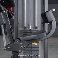 Thumbnail for Close-up of a black commercial triceps extension machine with a padded seat and backrest, and weight stack.