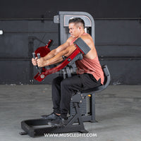 Thumbnail for Man using a red and black selectorized triceps extension machine in a gym.