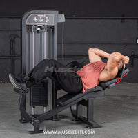 Thumbnail for Man performing an abdominal crunch on a selectorized gym machine.