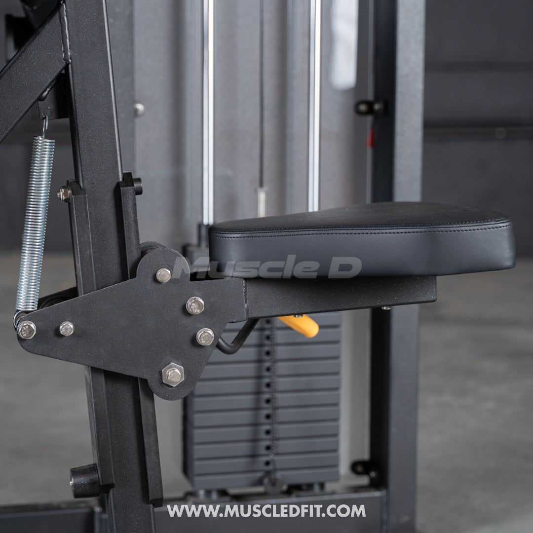 Close-up of a black padded seat and adjustment mechanism on a selectorized biceps curl machine.