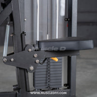 Thumbnail for Close-up of a black padded seat and adjustment mechanism on a selectorized biceps curl machine.
