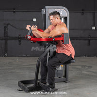 Thumbnail for Man using a red and black biceps curl machine with a weight stack.