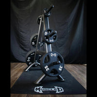 Thumbnail for Black urethane-coated Olympic weight plates on a storage rack, with a 