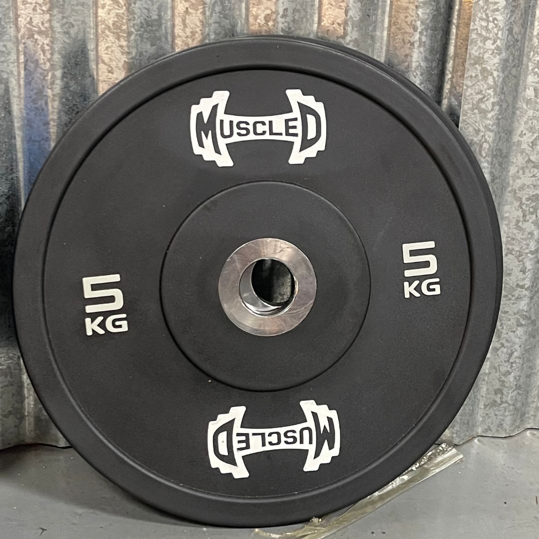 Black 5kg urethane bumper plate with "MUSCLED" logo and smooth metal hub.