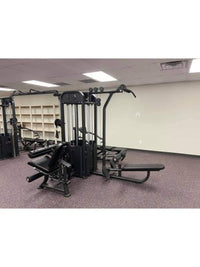 Thumbnail for Black multi-gym with various stations, including a lat pulldown and leg curl, on purple carpet.