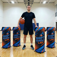 Thumbnail for Basketball player with four custom pop-up defenders on a court.