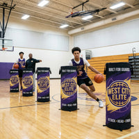 Thumbnail for Basketball players training with custom purple and gold pop-up defender cones on a court.