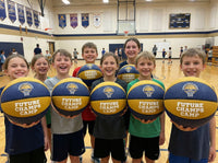 Thumbnail for Children holding basketballs with 'Future Champs Camp' text in a gymnasium.