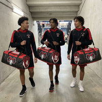 Thumbnail for Three athletes carrying black and red duffle bags with a ram logo and custom names/numbers.