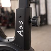 Thumbnail for Close-up of the A5-S exercise bike's black frame with an adjustment knob.