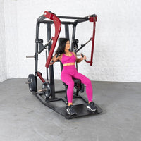 Thumbnail for Woman in pink working out on a black and red plate-loaded chest press machine.