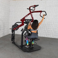 Thumbnail for Woman using a red and black plate-loaded rotary lat pull-down machine.