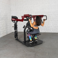 Thumbnail for Woman using a red and black plate-loaded rotary lat pull-down machine.