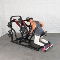 Thumbnail for Man using a red and black chest-supported plate-loaded row machine with 45lb plates.