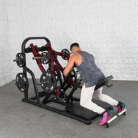 Thumbnail for Man using a chest-supported plate-loaded row machine with 45lb plates.