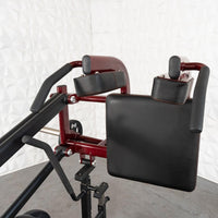 Thumbnail for Close-up of a red and black adjustable plate-loaded squat machine with padded backrest and shoulder pads.