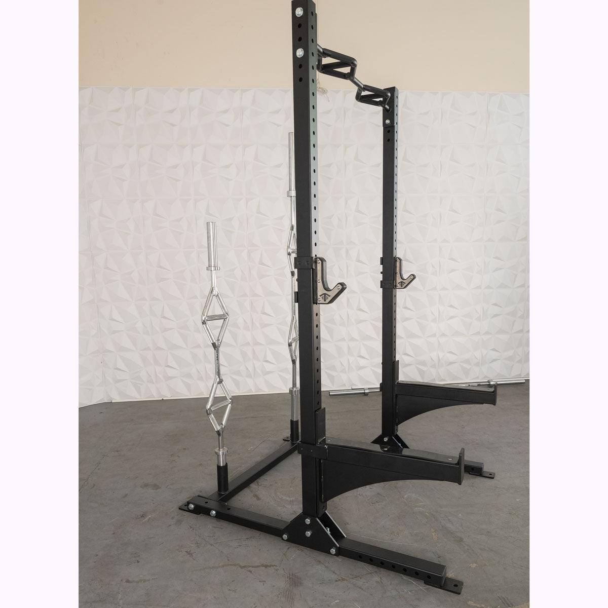 Black squat stand with multi-grip pull-up bar, J-hooks, and barbell storage.