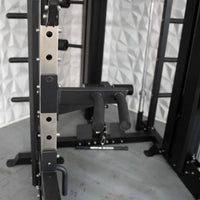 Thumbnail for Close-up of a black and silver fitness machine with dip handles and weight plate storage pegs.