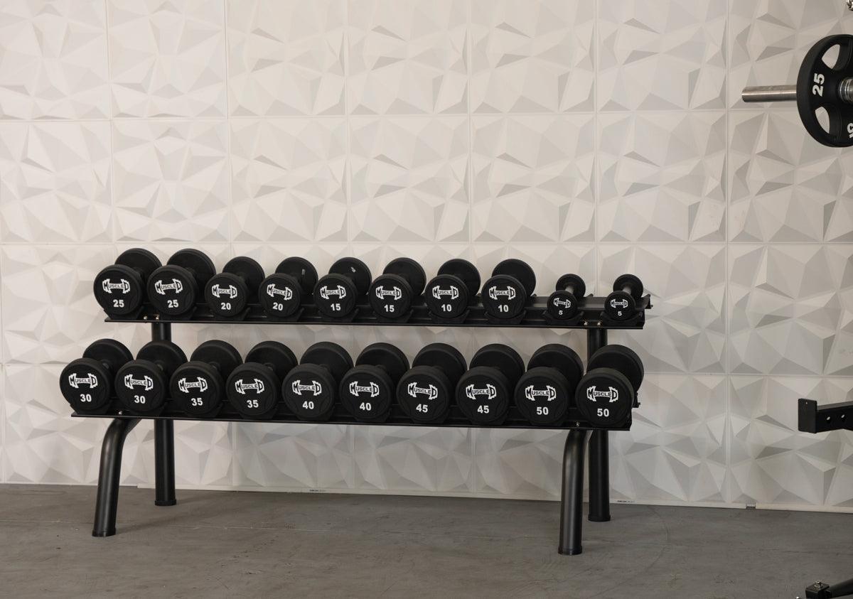 Black urethane dumbbells on a two-tier rack, ranging from 5lb to 50lb.